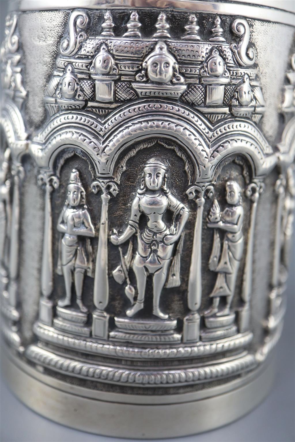 A late 19th century Indian repousse silver mug by P. Orr & Sons, Madras,